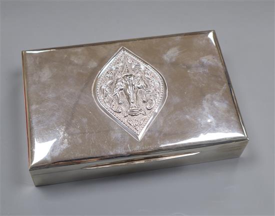 A Thai sterling 925 rectangular cigarette box, with embossed lid, 19cm.